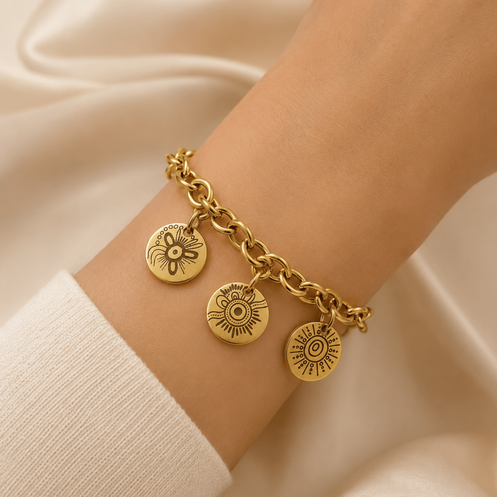 18k gold-plated custom charm bracelet worn on the wrist